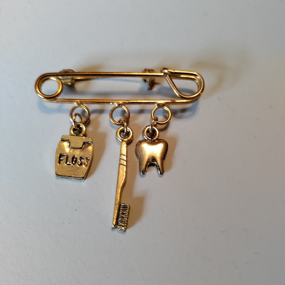 Dental Pin w/ 3 Charms. Gold tone. Fun to wear. Toothbrush